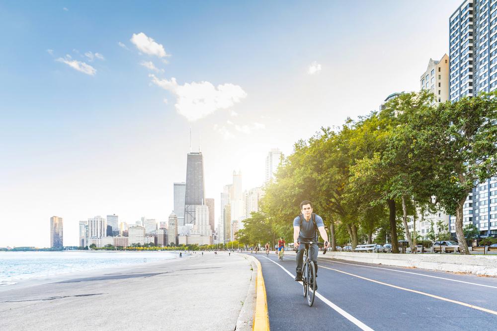 A cyclist riding in a designated bike lane under Chicago’s bike laws.